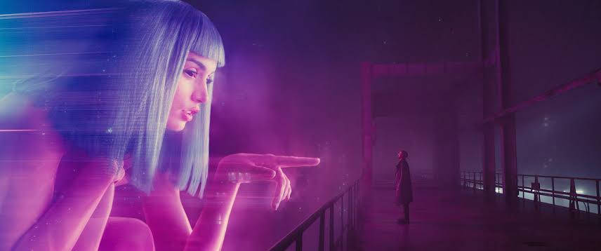 Blade Runner 2049 begins with sweeping visuals of a dystopian wasteland, setting mood and scale.