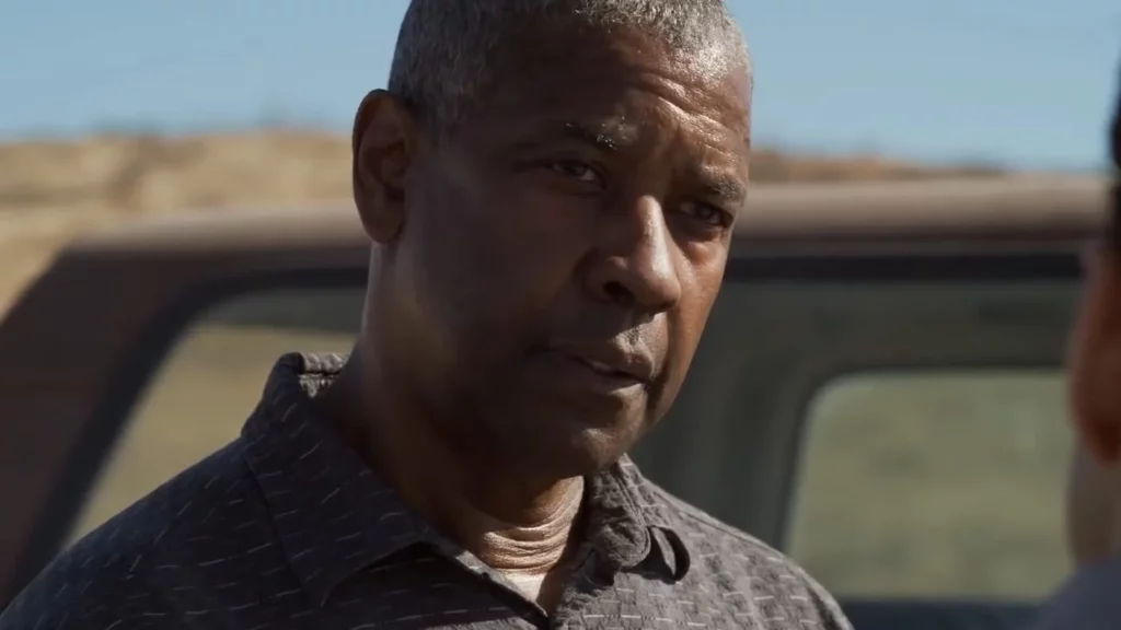 Close-up of Denzel Washington as Joe Deacon in a scene from the movie The Little Things, showing a concerned expression.