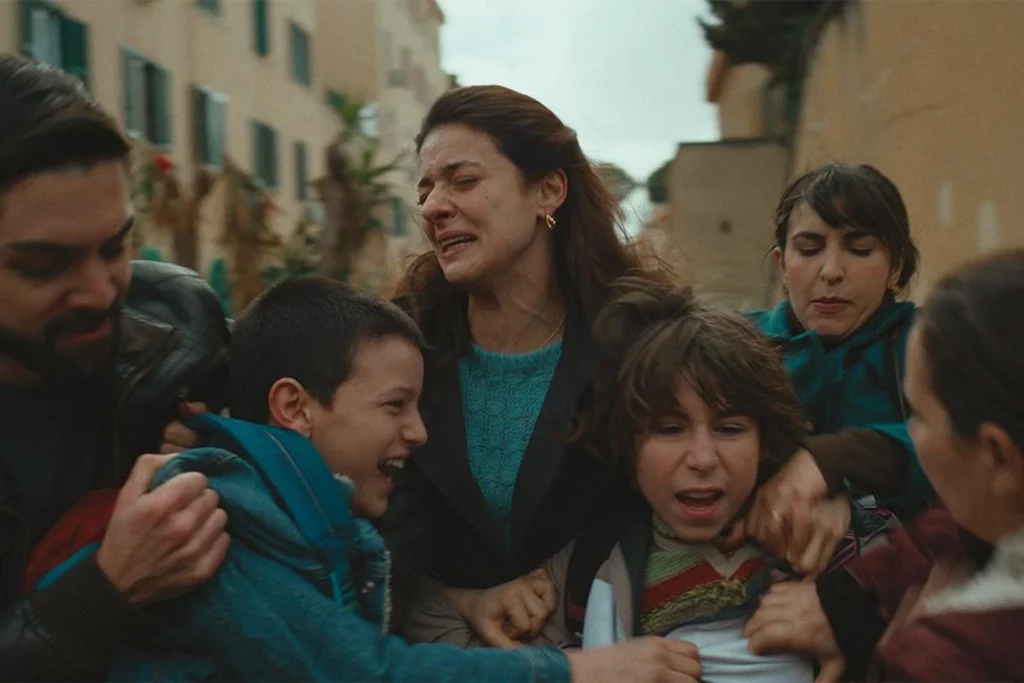 An intense scene of domestic conflict from the movie Familia featuring Barbara Ronchi and Francesco Di Leva amidst a family struggle.