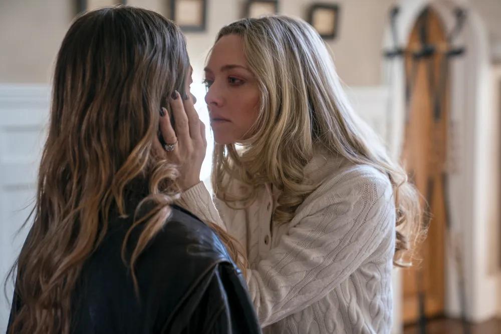 Intense emotional confrontation between two women inside a modern house, key dramatic moment from The Housemaid movie