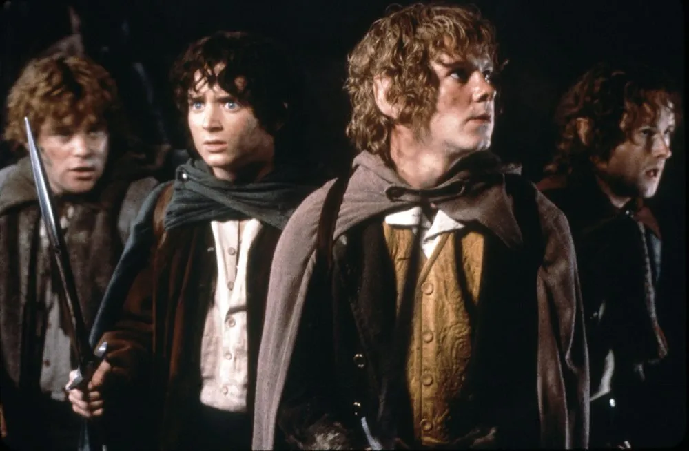 Classic Lord of the Rings fellowship moment with four hobbits on a dangerous Middle-earth journey