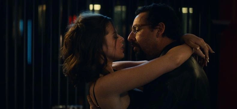 Actors rehearsing a choreographed intimate scene on a closed film set