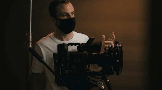 film crew shooting movie scene using professional cinema camera equipment