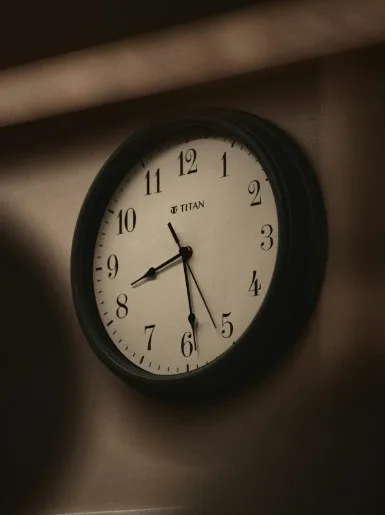 A close-up of a ticking clock during a tense scene.