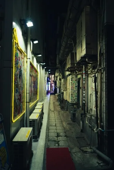 A tilted shot of a street scene, suggesting imbalance and disorientation.