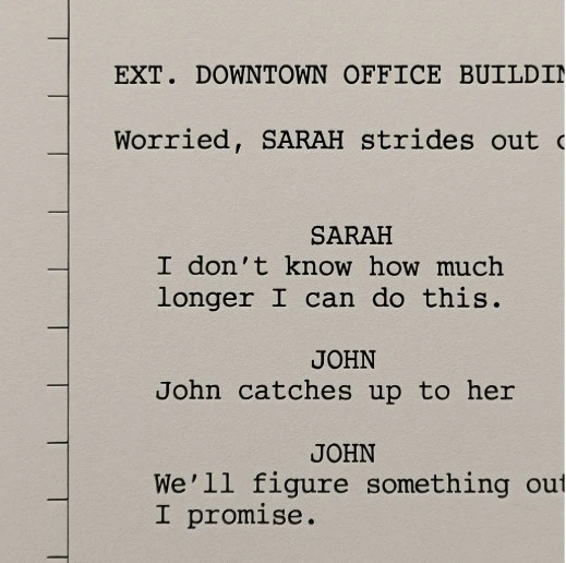 A close-up of a screenplay page with vertical tick marks every inch along the margin, dividing the page into eight segments.