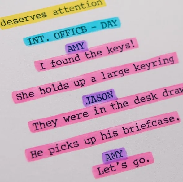 A close-up of a script page with various elements highlighted in different colors (e.g., purple for characters, yellow for props).