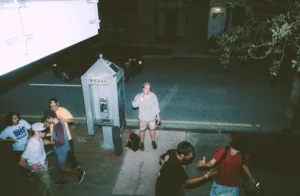 Filming a dramatic scene with actors on set