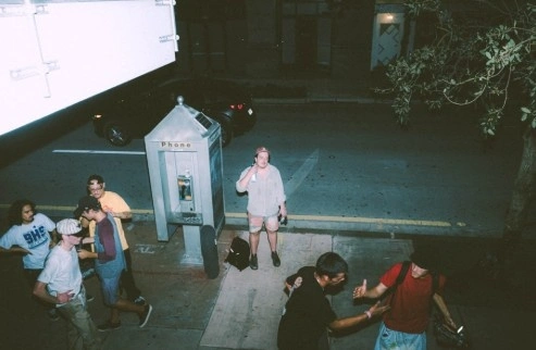 Filming a dramatic scene with actors on set